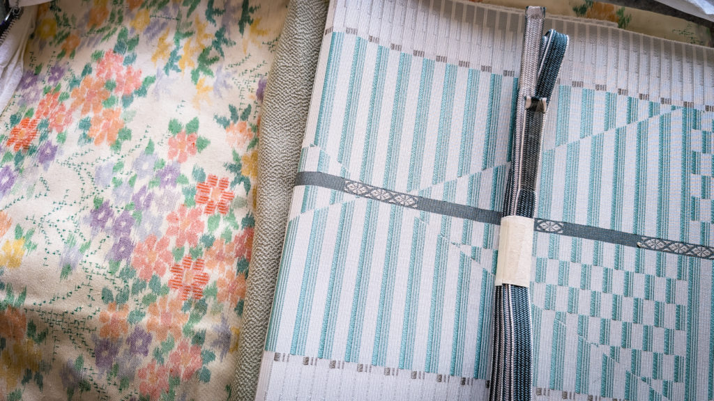Yellow kimono with flower pattern and white/turquoise obi